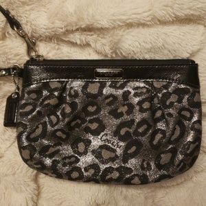 Black and silver animal print Coach wristlet